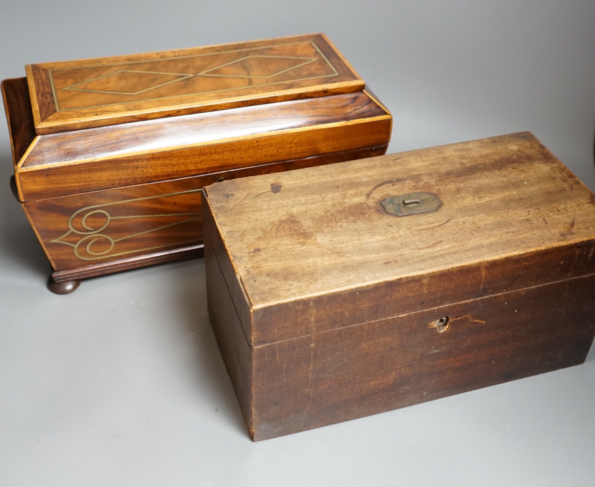 A Regency brass inlaid sarcophagus tea caddy and a George III mahogany caddy, sarcophagus caddy, 18.5cms high